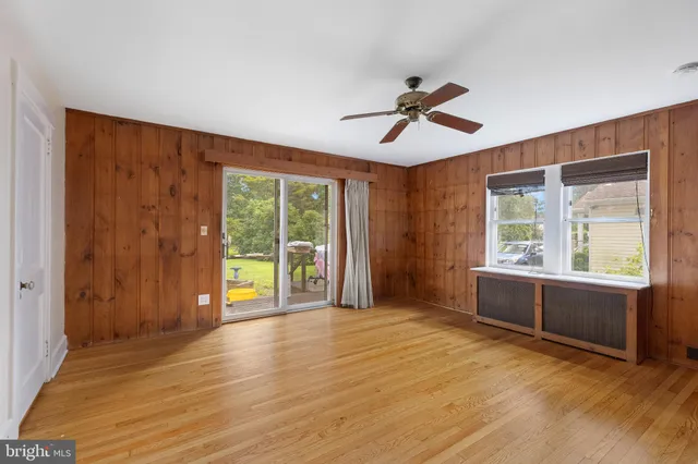 a view of room with furniture and windows