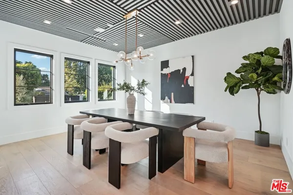 a view of a living room and kitchen with stainless steel appliances granite countertop room