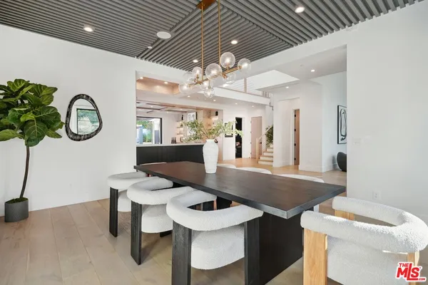 a living room with furniture and a projector