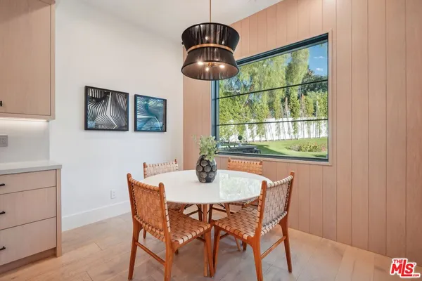 a view of a living room with furniture and a rug
