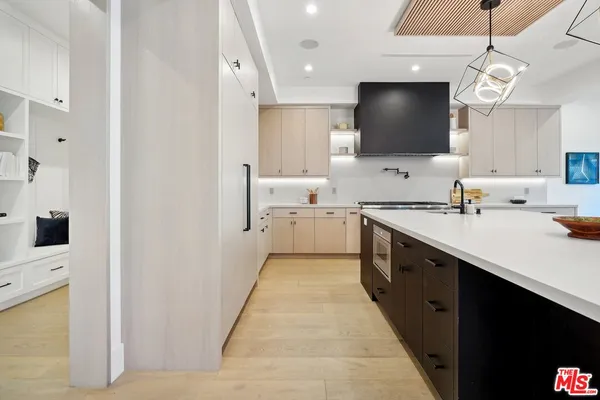 a bedroom with 2 bed and a window