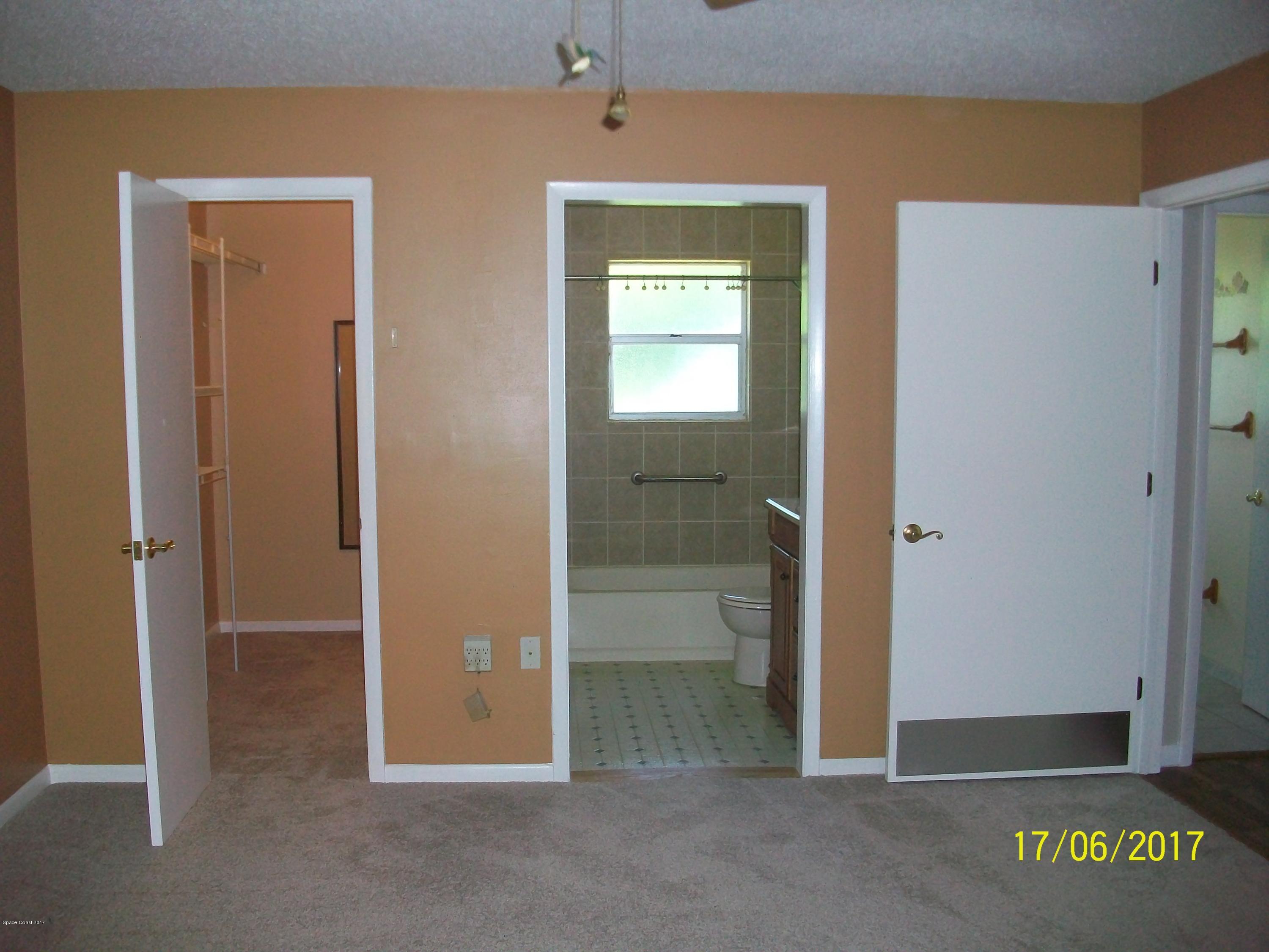 109 Tucson Road Southwest Palm Bay, FL 32908 - Photo 15 of 31 Master Bedroom