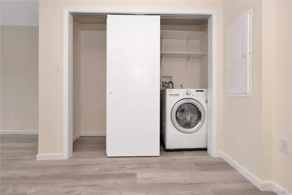 a view of a storage & utility room with washer and dryer