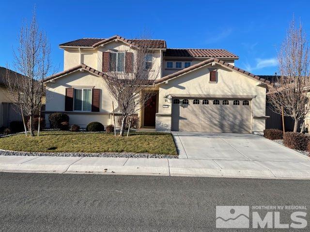 2071 Whitecliff Drive Reno, NV 89521 - Photo 1 of 24 a front view of a house with a yard