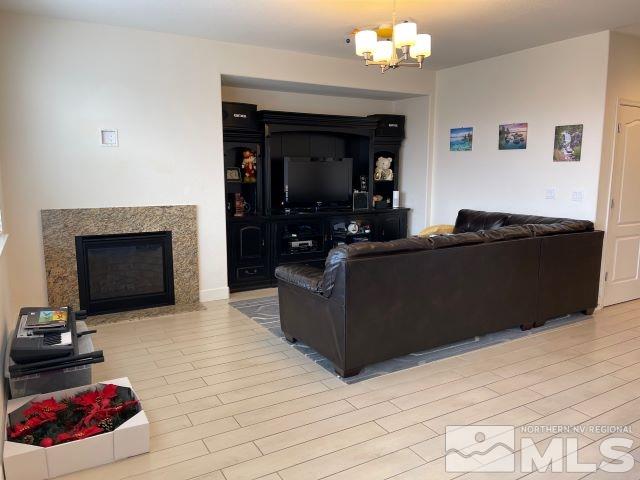 2071 Whitecliff Drive Reno, NV 89521 - Photo 11 of 24 a living room with furniture and a fireplace