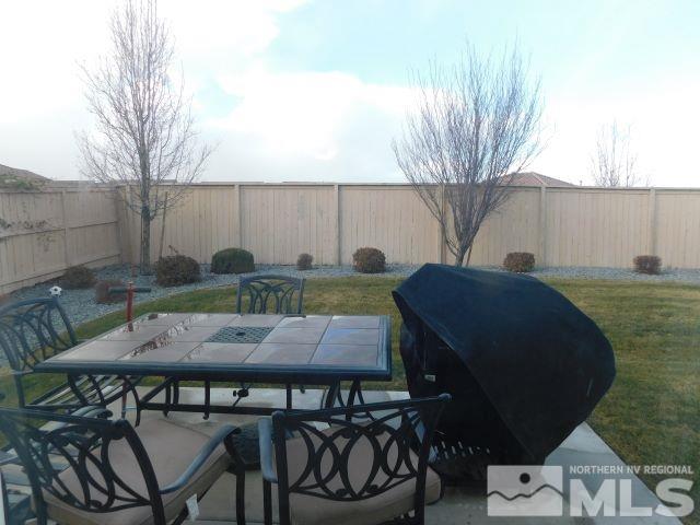 2071 Whitecliff Drive Reno, NV 89521 - Photo 14 of 24 a backyard of a house with table and chairs