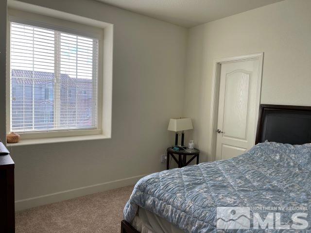 2071 Whitecliff Drive Reno, NV 89521 - Photo 15 of 24 a bedroom with a bed and a window