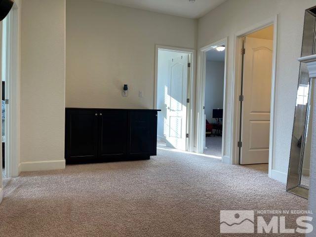 2071 Whitecliff Drive Reno, NV 89521 - Photo 19 of 24 a view of an empty room with a cabinet and mirror