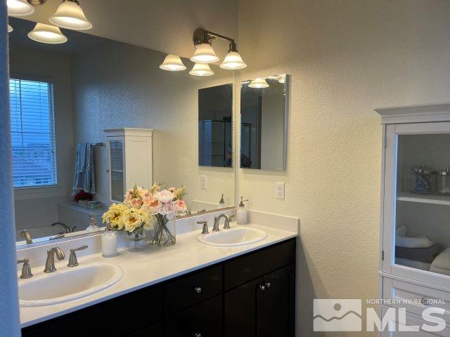 2071 Whitecliff Drive Reno, NV 89521 - Photo 20 of 24 a bathroom with a sink and a mirror
