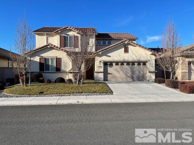 2071 Whitecliff Drive Reno, NV 89521 - Photo 2 of 24 a front view of a house with a yard