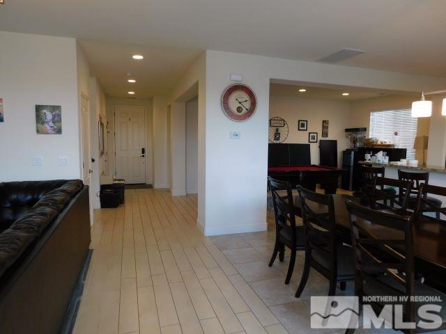 2071 Whitecliff Drive Reno, NV 89521 - Photo 4 of 24 a kitchen with stainless steel appliances granite countertop a table and chairs