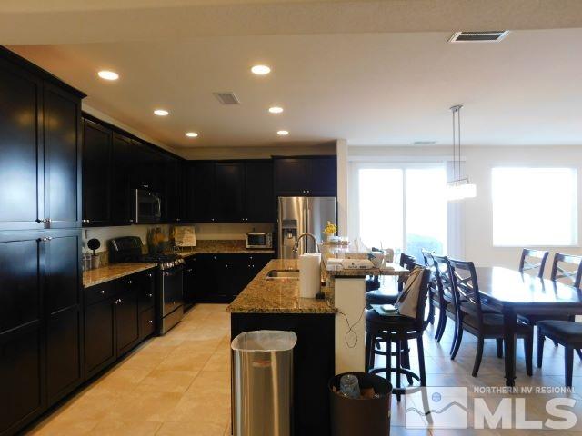 2071 Whitecliff Drive Reno, NV 89521 - Photo 6 of 24 a kitchen with counter space cabinets and appliances