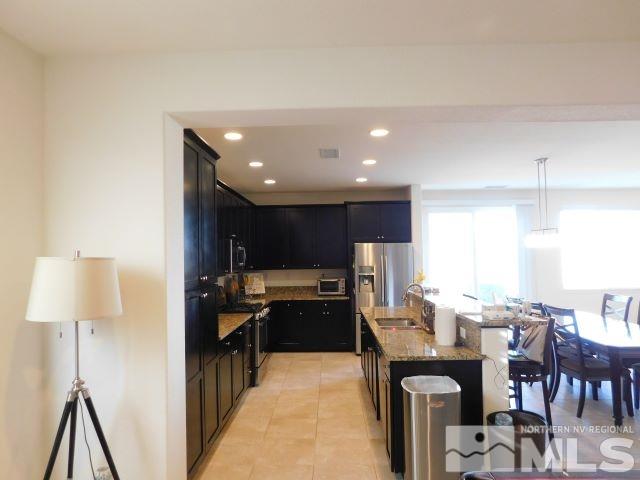 2071 Whitecliff Drive Reno, NV 89521 - Photo 9 of 24 a large kitchen with lots of counter space and furniture