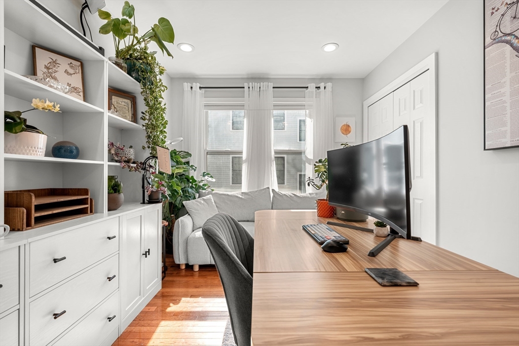 78-80 Rossmore Road, Unit 2 Boston, MA 02130 - Photo 12 of 19 a living room with furniture and a flat screen tv