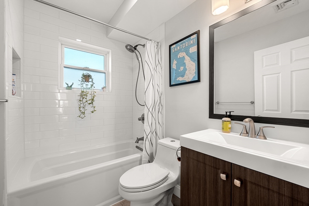 78-80 Rossmore Road, Unit 2 Boston, MA 02130 - Photo 14 of 19 a bathroom with a sink a toilet and shower