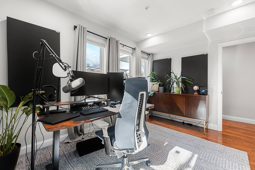 78-80 Rossmore Road, Unit 2 Boston, MA 02130 - Photo 16 of 19 a living room with furniture and wooden floor