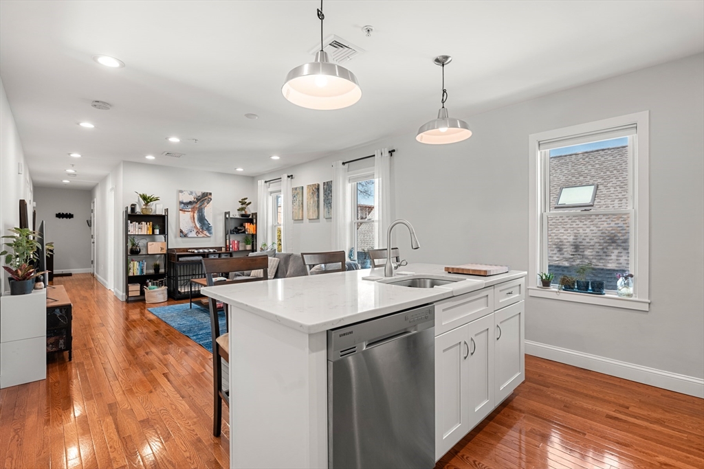 78-80 Rossmore Road, Unit 2 Boston, MA 02130 - Photo 2 of 19 a kitchen with a sink stove and wooden floor