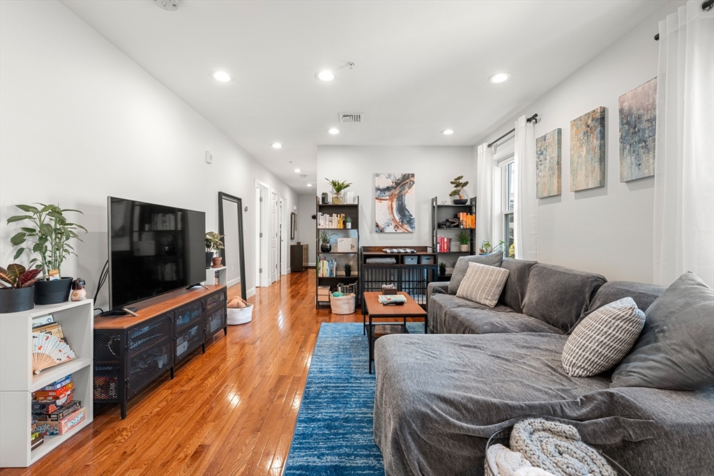 78-80 Rossmore Road, Unit 2 Boston, MA 02130 - Photo 3 of 19 a living room with furniture and a flat screen tv