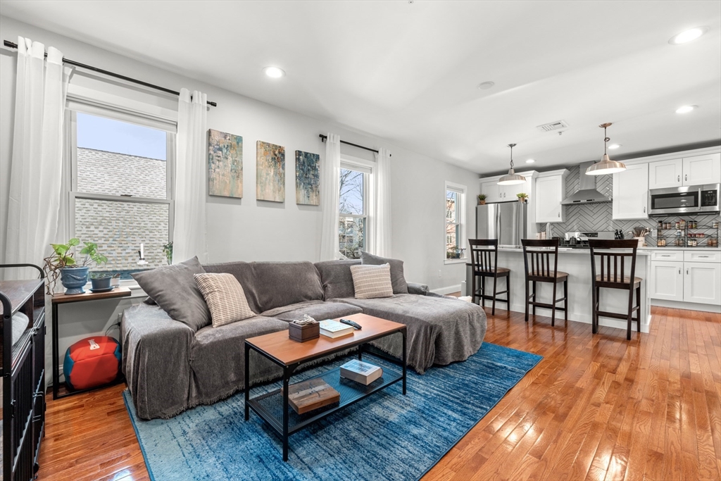 78-80 Rossmore Road, Unit 2 Boston, MA 02130 - Photo 4 of 19 a living room with furniture and kitchen view