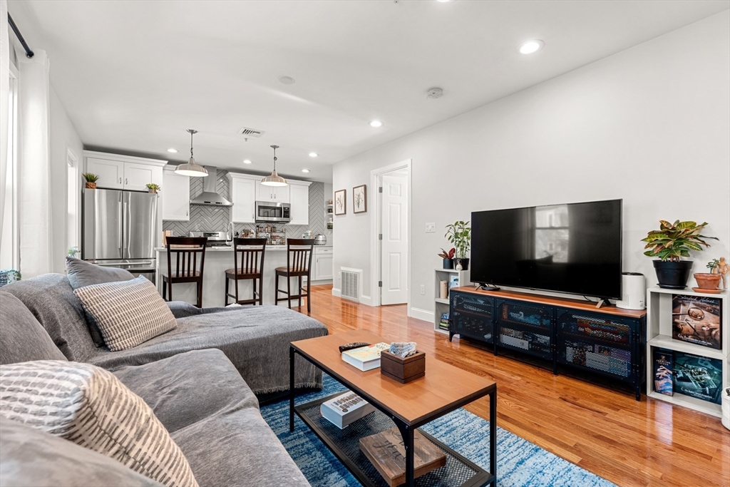 78-80 Rossmore Road, Unit 2 Boston, MA 02130 - Photo 5 of 19 a living room with furniture and a flat screen tv