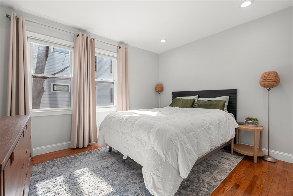 78-80 Rossmore Road, Unit 2 Boston, MA 02130 - Photo 8 of 19 a bedroom with a bed and wooden floor