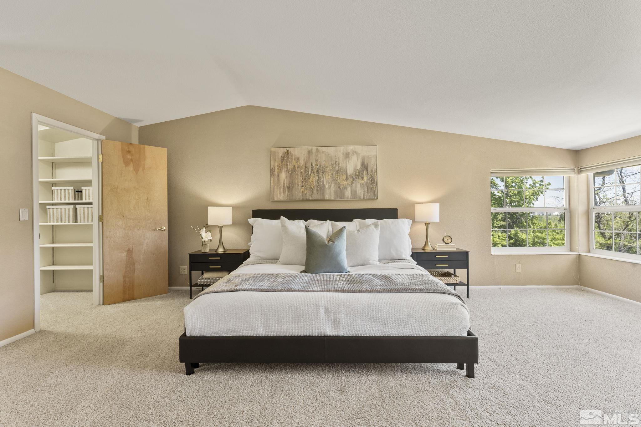 2250 Barnes Boulevard Reno, NV 89509 - Photo 11 of 40 a bedroom with a large bed and a window