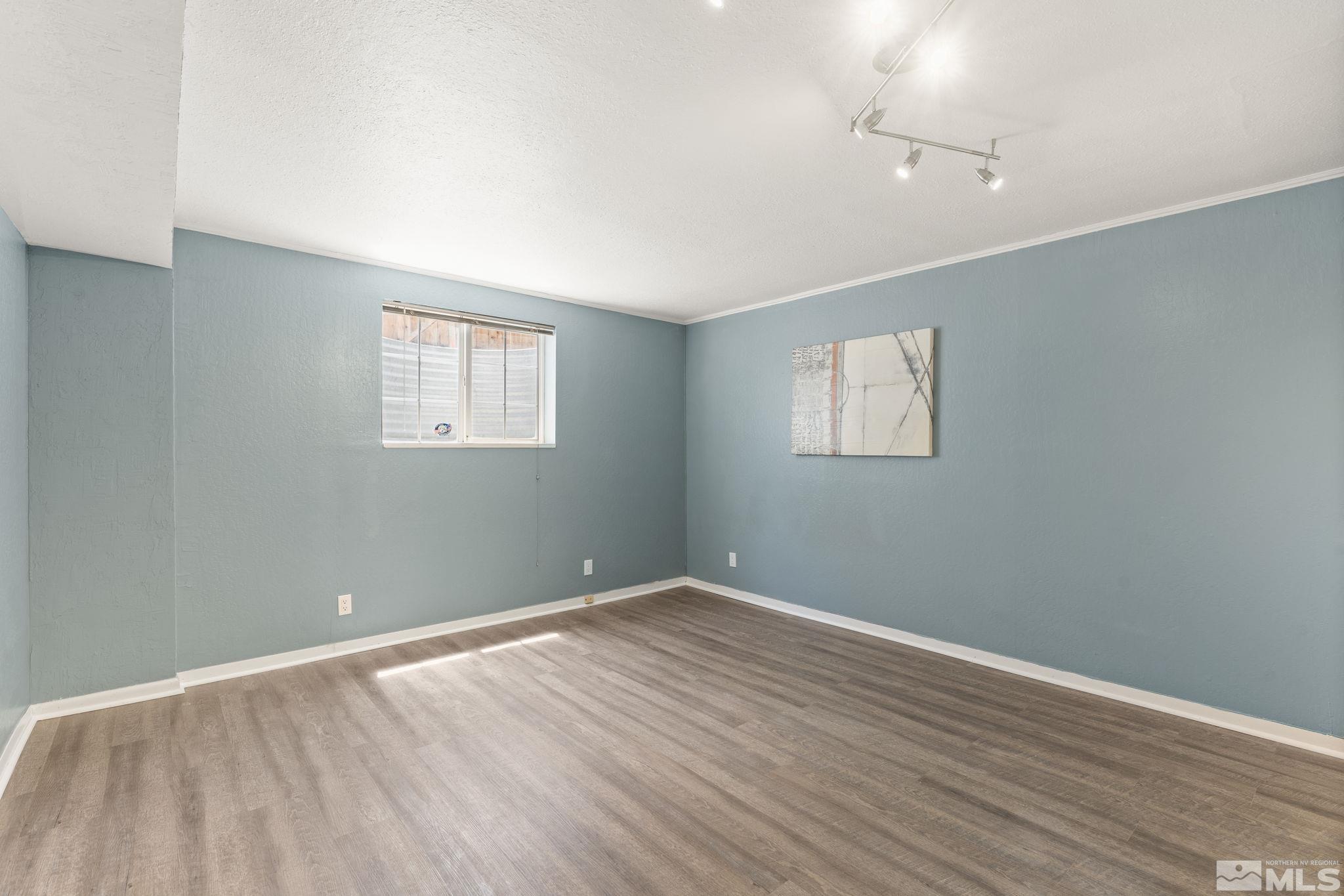 2250 Barnes Boulevard Reno, NV 89509 - Photo 24 of 40 wooden floor in an empty room with a window