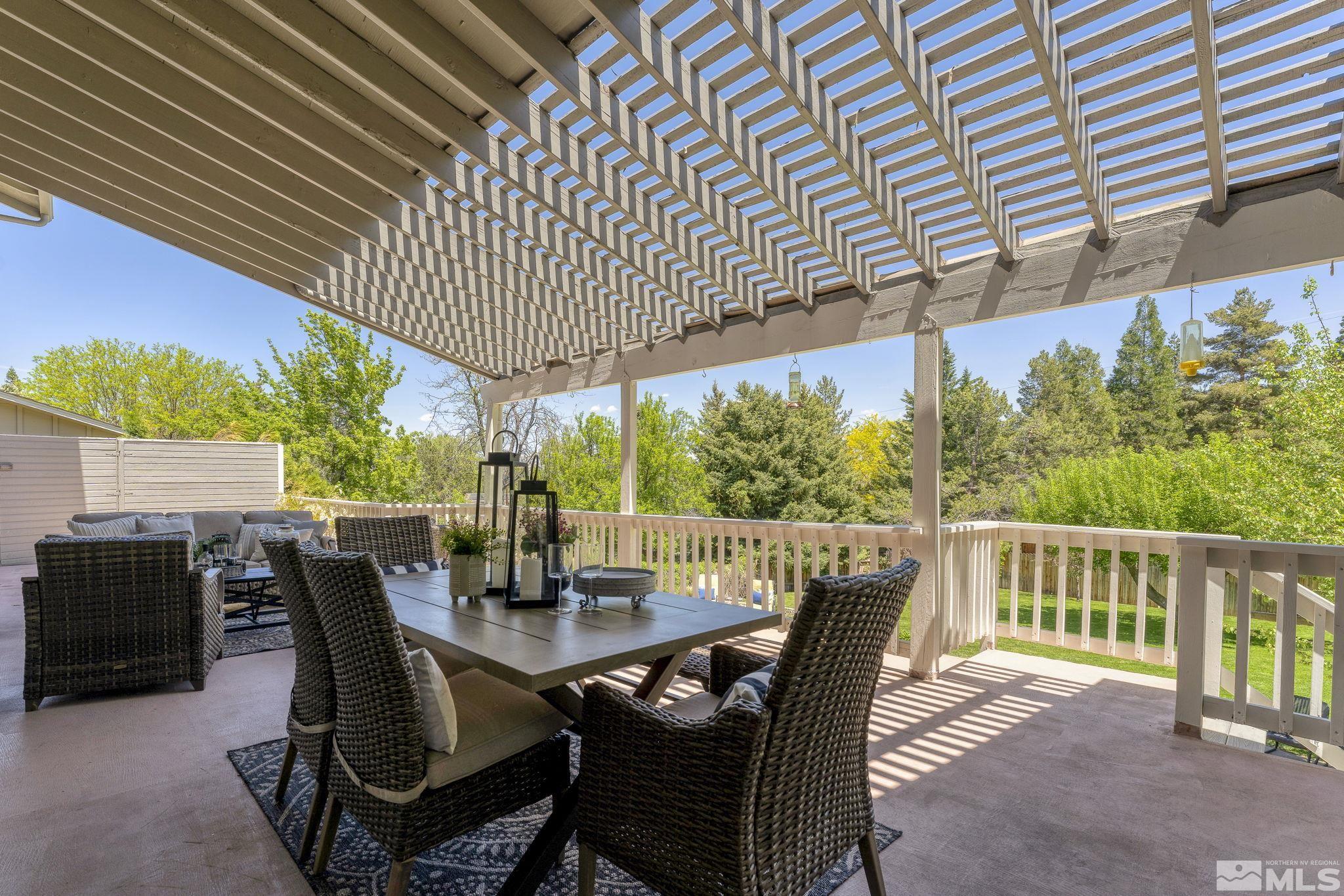 2250 Barnes Boulevard Reno, NV 89509 - Photo 27 of 40 a view of a dining table and chairs in the patio