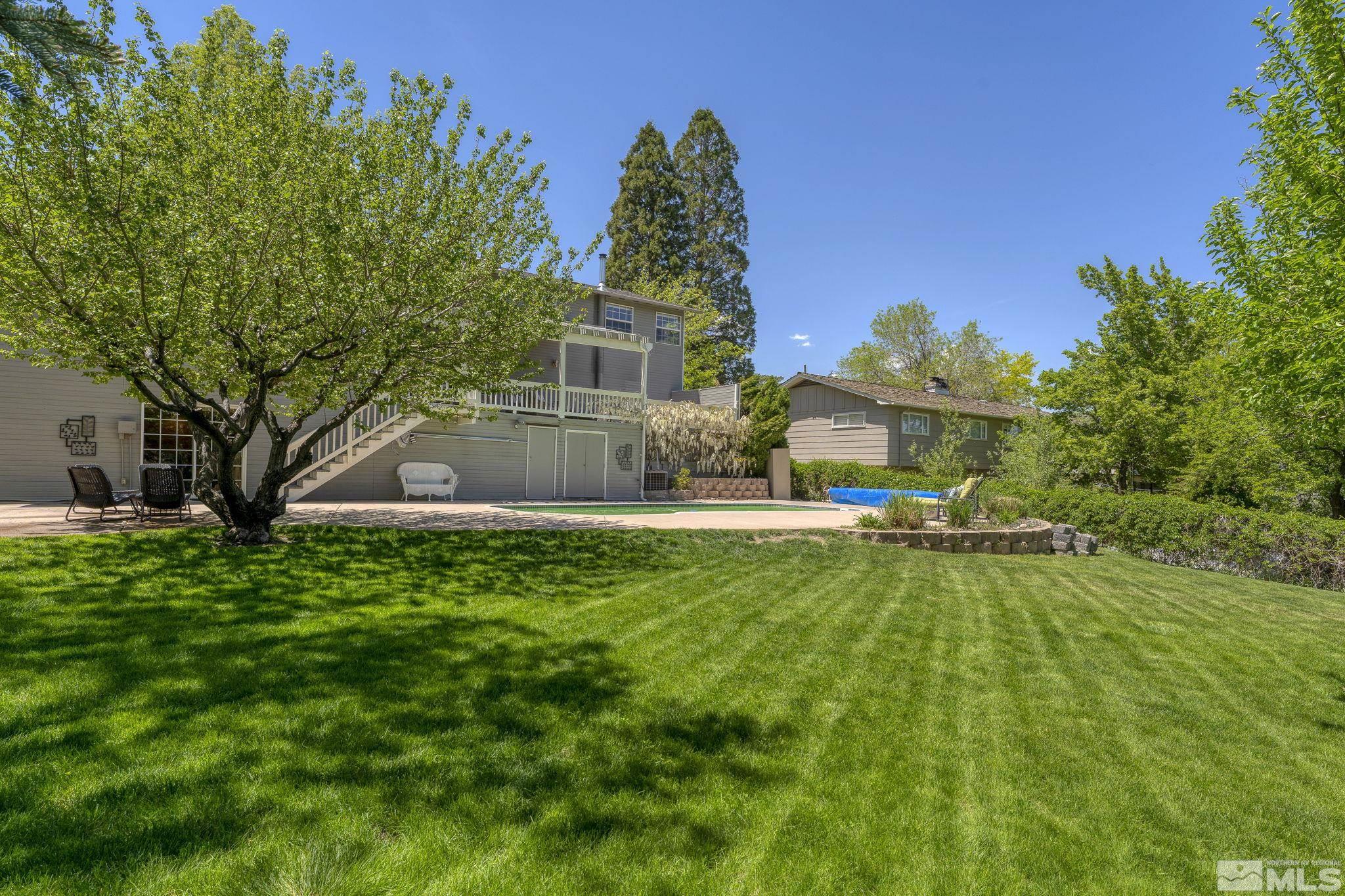 2250 Barnes Boulevard Reno, NV 89509 - Photo 30 of 40 a front view of a house with a yard