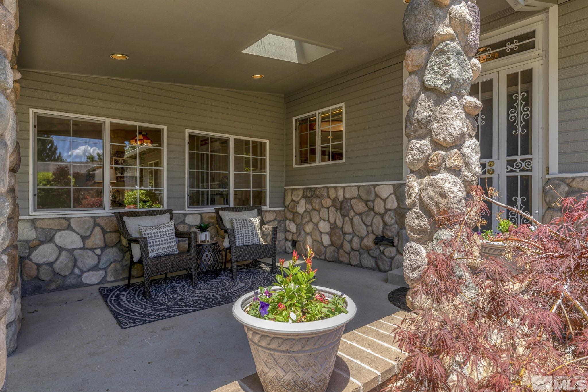 2250 Barnes Boulevard Reno, NV 89509 - Photo 3 of 40 a view of a porch with furniture and a potted plant