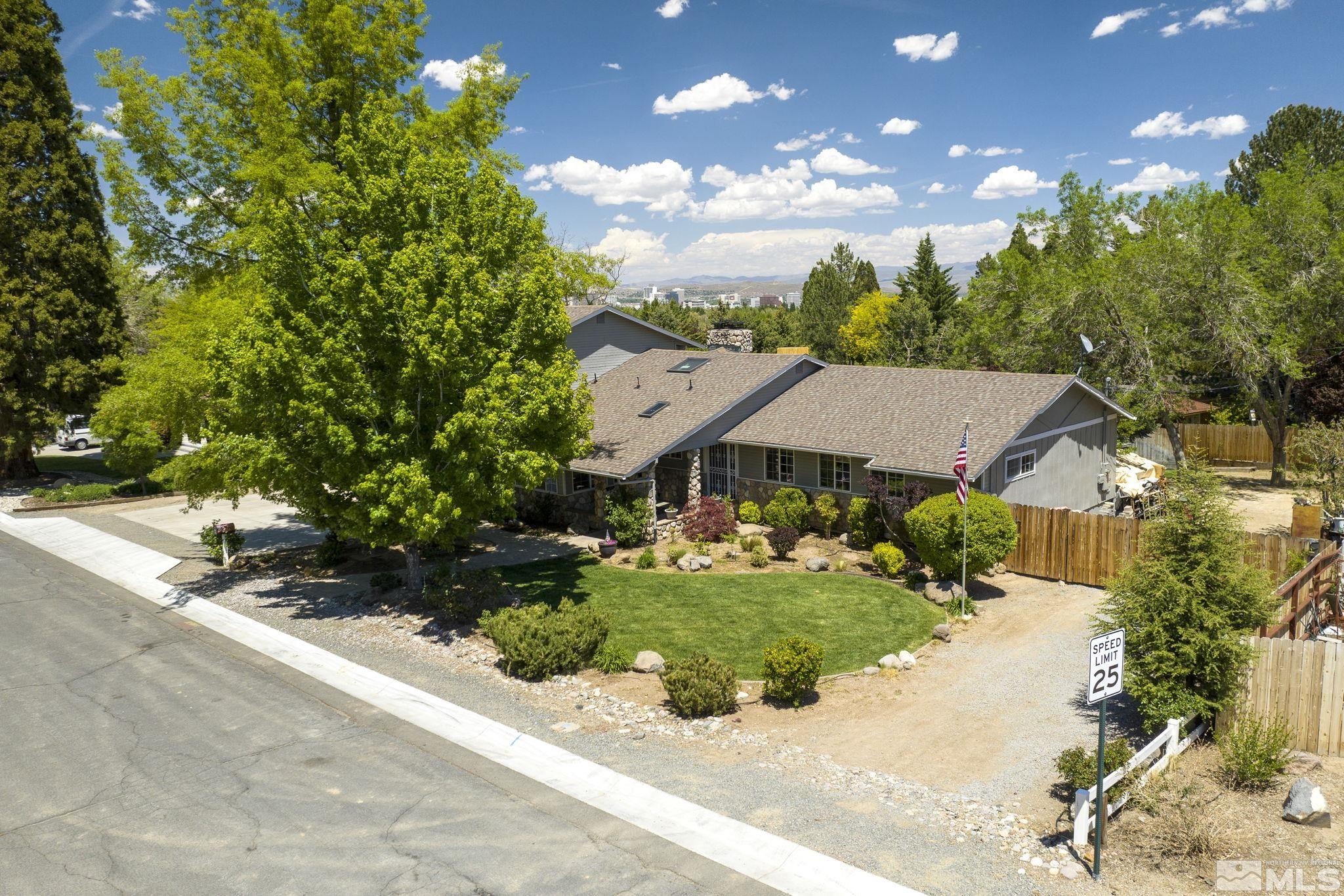 2250 Barnes Boulevard Reno, NV 89509 - Photo 33 of 40 a view of a house with a yard and potted plants
