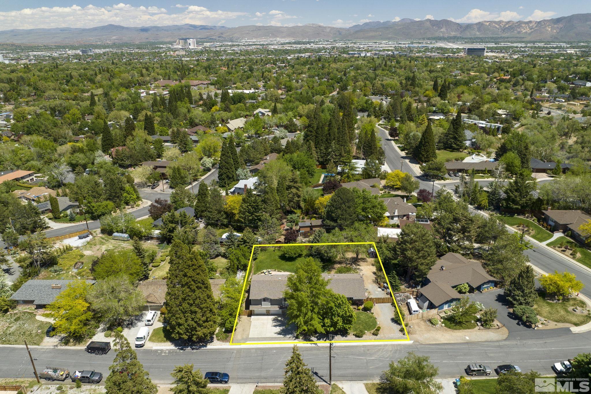 2250 Barnes Boulevard Reno, NV 89509 - Photo 36 of 40 an aerial view of residential house with parking space and mountain view