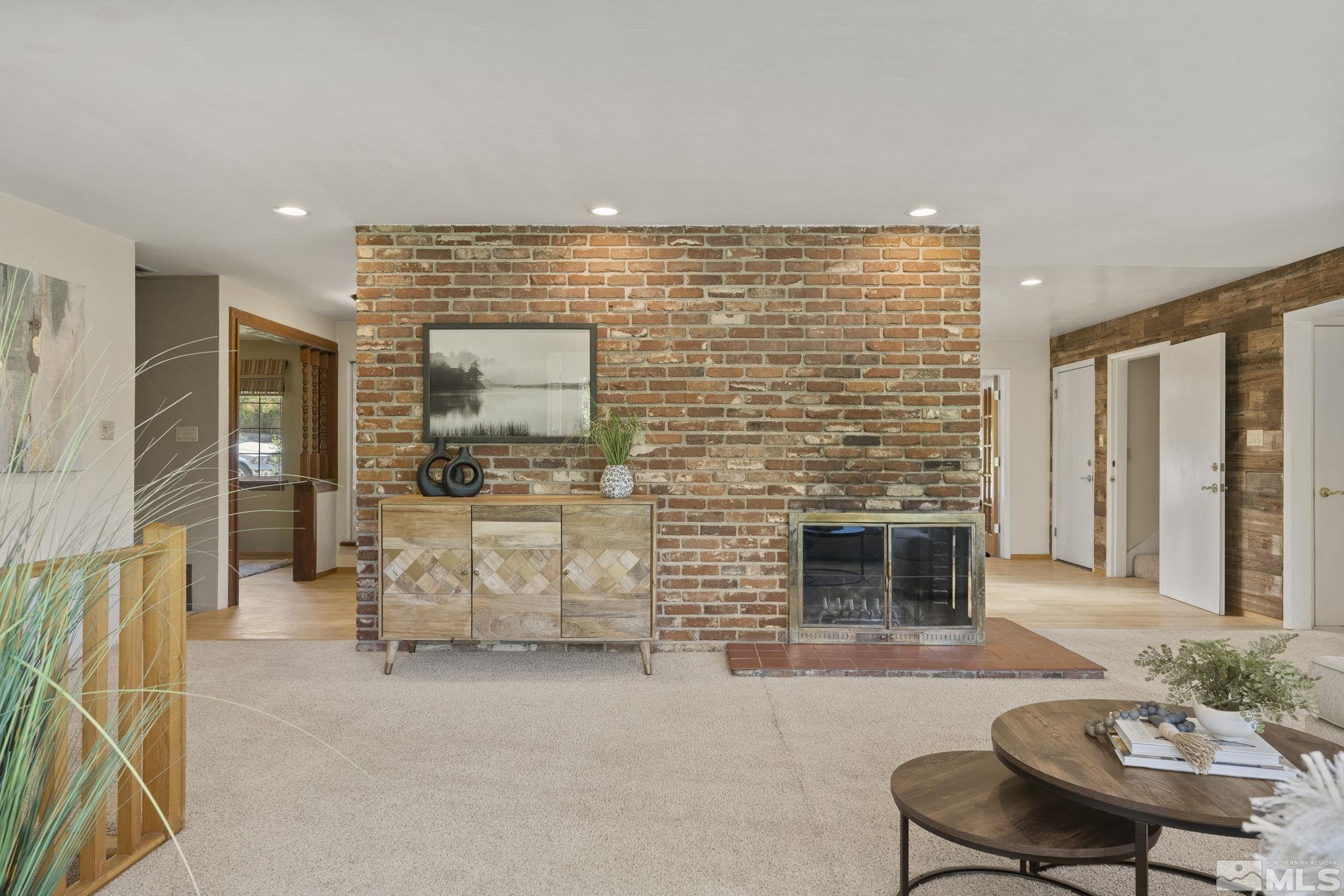 2250 Barnes Boulevard Reno, NV 89509 - Photo 5 of 40 a living room with furniture and a fireplace
