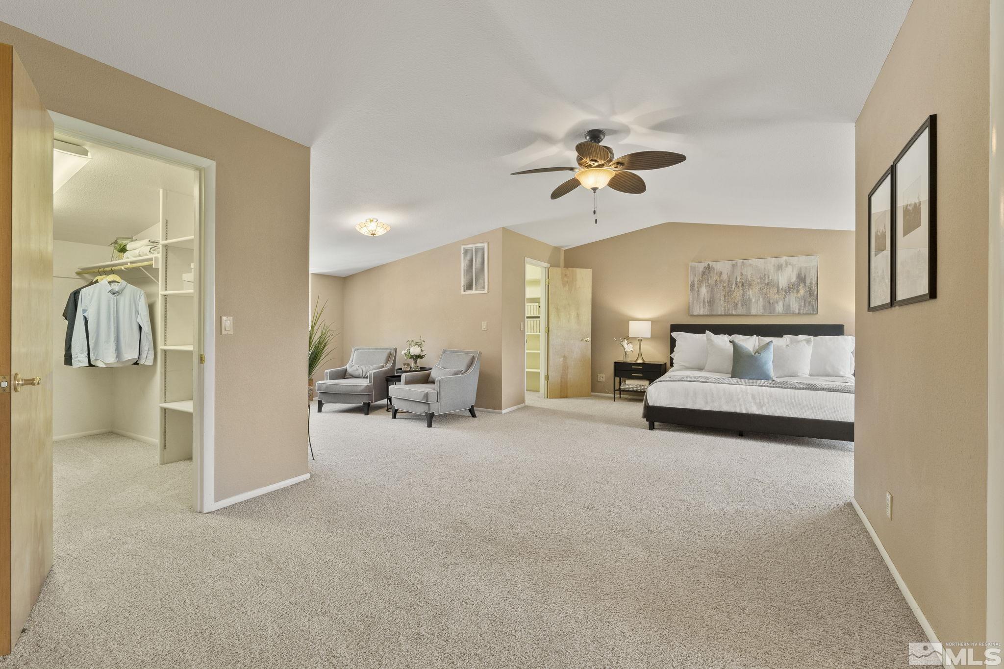 2250 Barnes Boulevard Reno, NV 89509 - Photo 10 of 40 a view of a livingroom with a couch and a chandelier fan