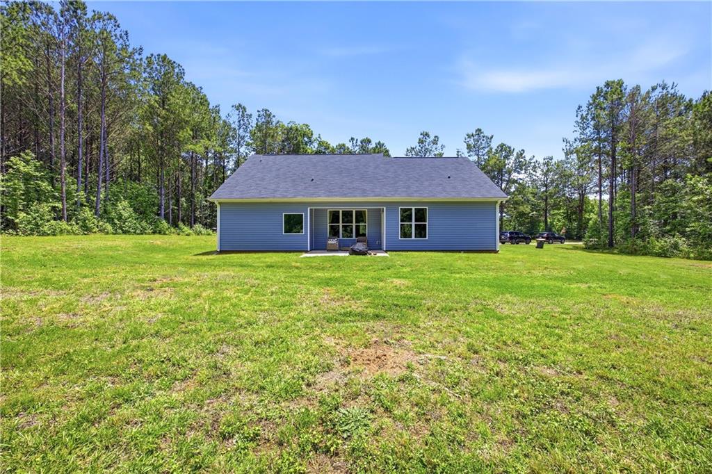 70 Gold Mine Road Grantville, GA 30220 - Photo 20 of 23 a front view of a house with a garden