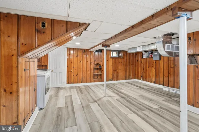 a bedroom with a bed and a ceiling fan