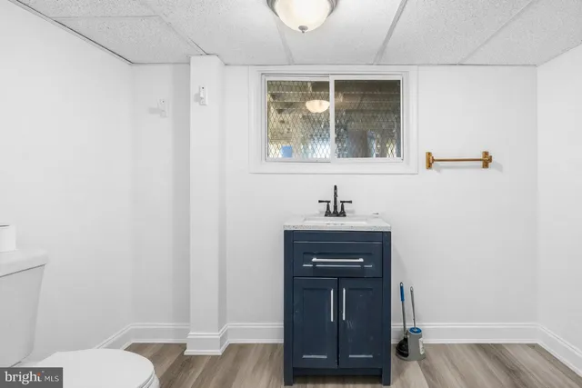 a view of a kitchen with wooden floor
