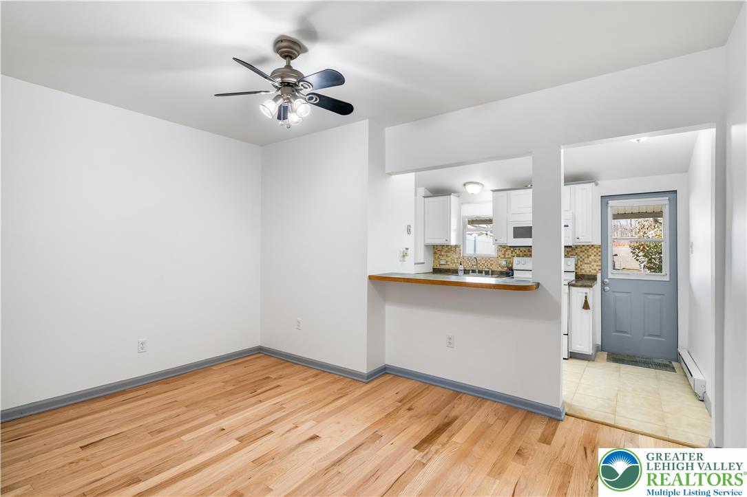 2507 Levans Road Coplay, PA 18037 - Photo 26 of 46 a view of a kitchen with wooden floor and a ceiling fan