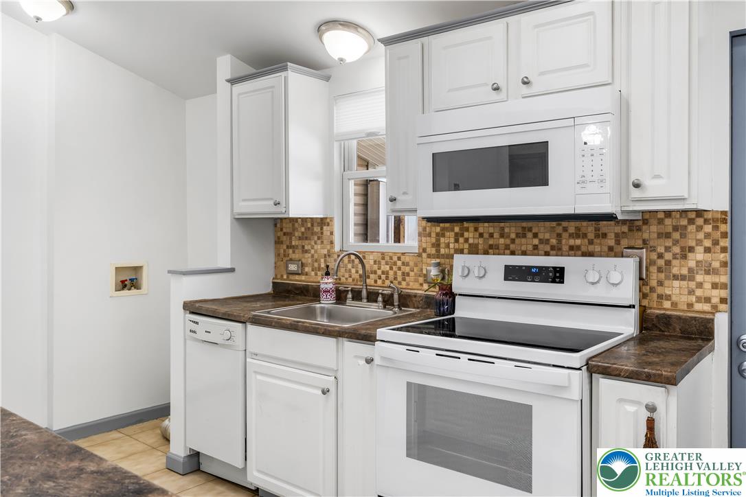 2507 Levans Road Coplay, PA 18037 - Photo 32 of 46 a kitchen with appliances a stove and cabinets