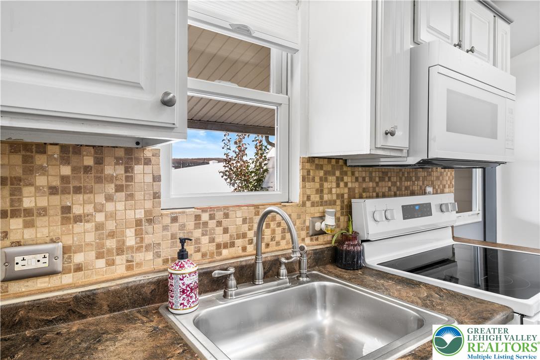 2507 Levans Road Coplay, PA 18037 - Photo 34 of 46 a kitchen with a sink and a stove top oven