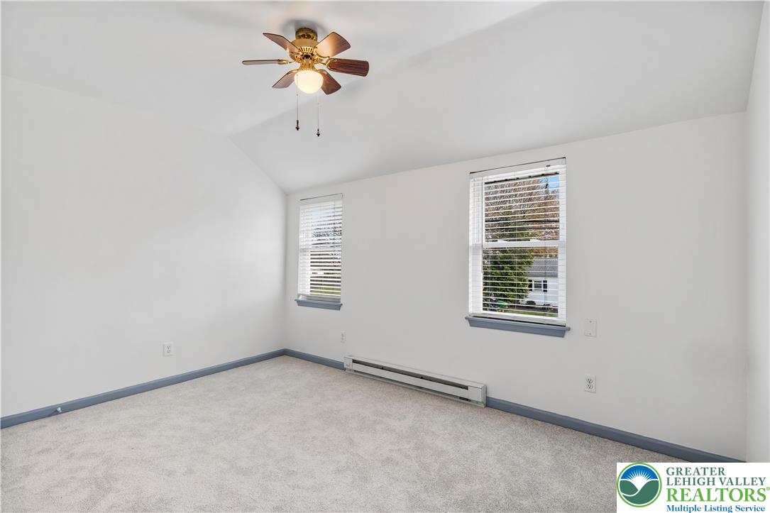 2507 Levans Road Coplay, PA 18037 - Photo 38 of 46 an empty room with a window and a ceiling fan