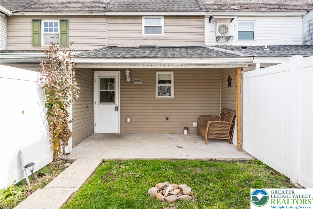 2507 Levans Road Coplay, PA 18037 - Photo 10 of 46 a view of a backyard with table and chairs and potted plants