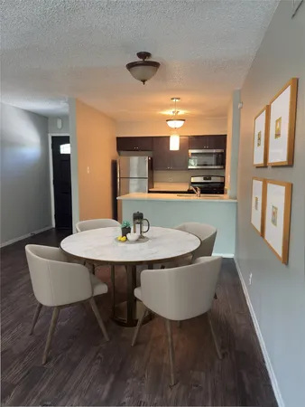 a view of a dining room with furniture