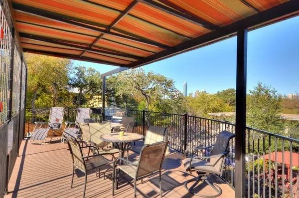 a view of a backyard with sitting area