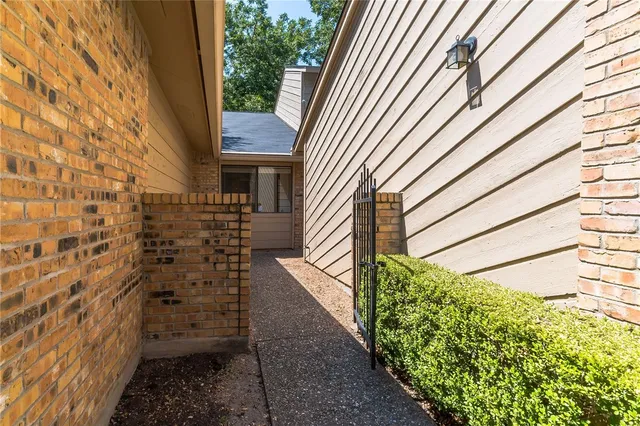 a view of a pathway with a wall