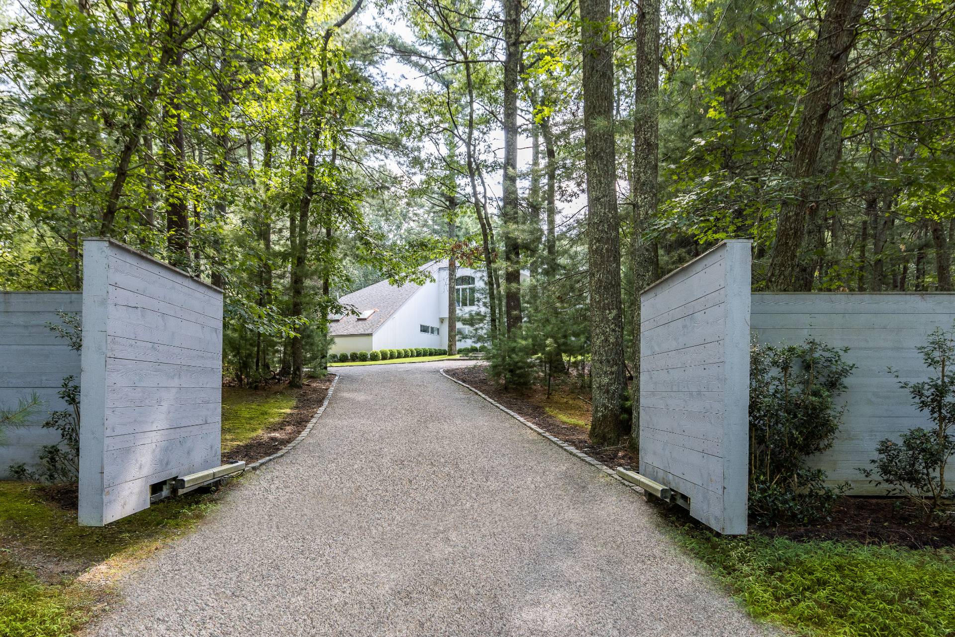 52 Bull Path East Hampton, NY 11937 - Photo 23 of 24 a pathway of a house with large trees