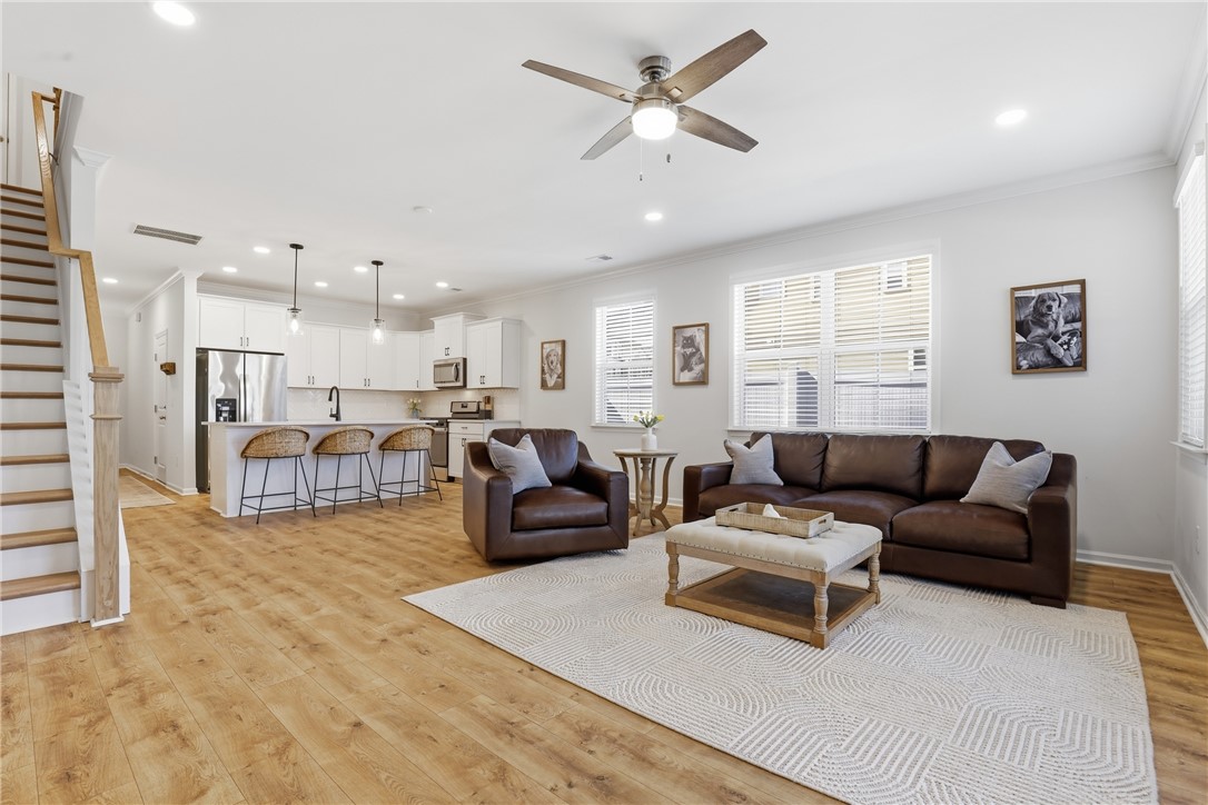 349 Stirrup Court Greer, SC 29651 - Photo 27 of 27 This inviting space features a seamless open floorplan, combining living, dining, and kitchen areas.