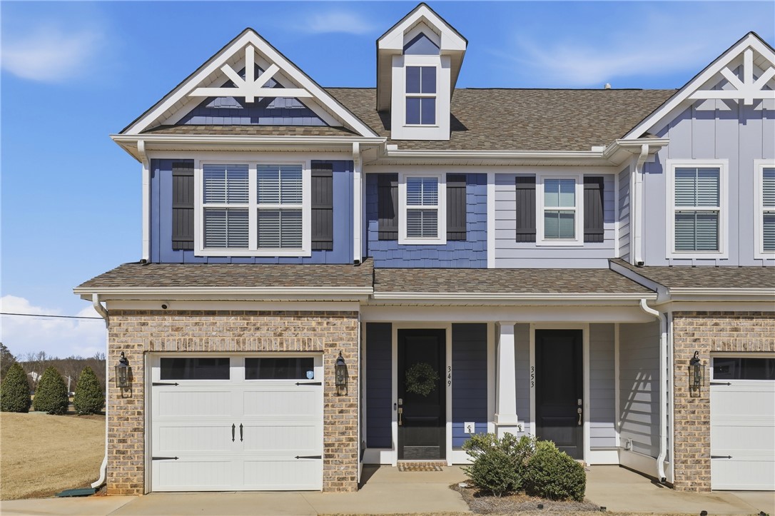 349 Stirrup Court Greer, SC 29651 - Photo 25 of 27 This charming home features a classic brick and siding exterior with a welcoming entrance.