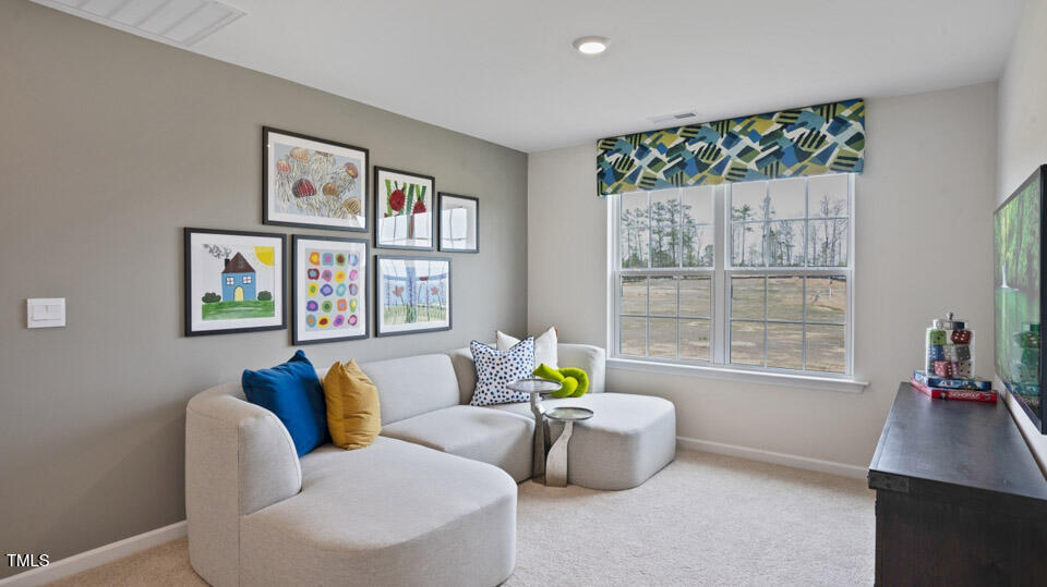 126 Daniel Road Smithfield, NC 27577 - Photo 21 of 37 a living room with furniture and a large window