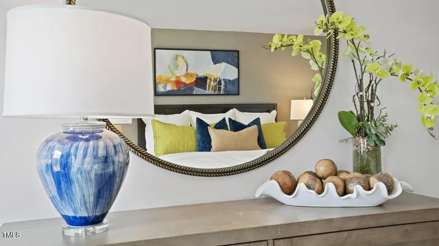 a bathroom with a granite countertop sink a mirror and shower
